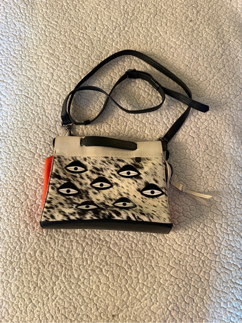 Min & Mon all over eyes Crossbody Bag with Orange Accent